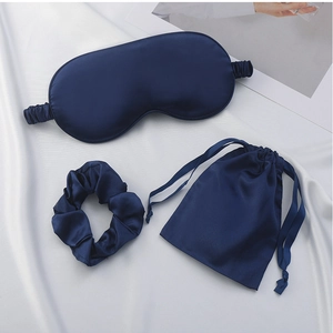 Three-piece satin sleep set with navy blue eye mask, scrunchie, and drawstring storage bag