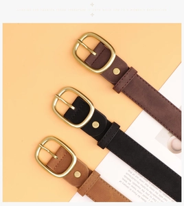 Three suede leather belts in brown, black and tan with golden oval metal buckles