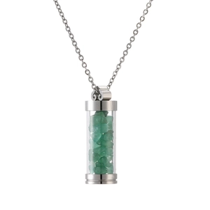 Detail of cylinder perfume bottle pendant with green natural stones on silver chain