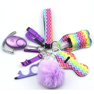 Detail view of purple self-defense keychain set including alarm and patterned neoprene strap