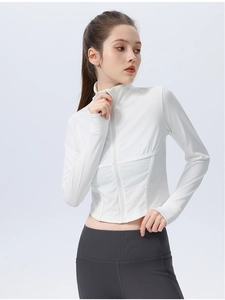 Close-up of white ribbed long sleeve yoga jacket with zip-up design and slim fit cut
