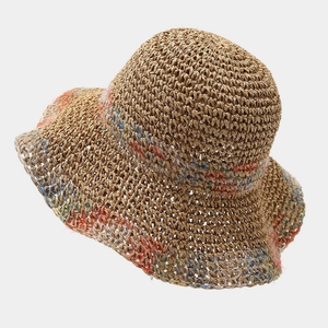 Women's colorful crochet straw sun hat with wide wavy brim for beach vacations