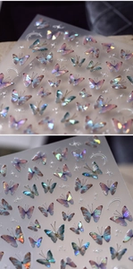 Macro detail of iridescent 5D butterfly nail stickers with laser rainbow holographic effect