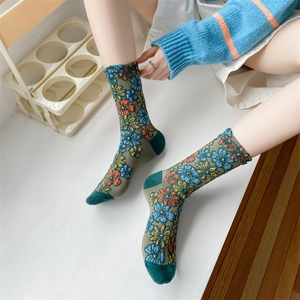 Retro deep green floral knit mid-calf socks with vintage orange and blue flower patterns