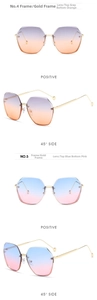 Detail view of two geometric sunglasses with gold metal frames and gradient tinted lenses