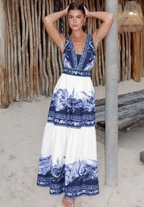 Detail of bohemian deep V-neck maxi dress with blue vintage floral prints and layered skirt