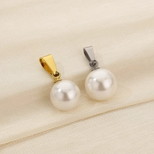 Macro view of white round pearl pendants with gold and silver titanium steel clasps