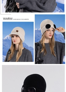 Close-up of winter knit beanie featuring integrated goggles and warm fleece lining