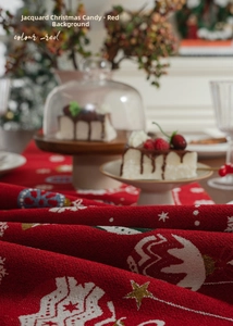 Close-up of red Christmas table runner featuring jacquard star and snowflake patterns