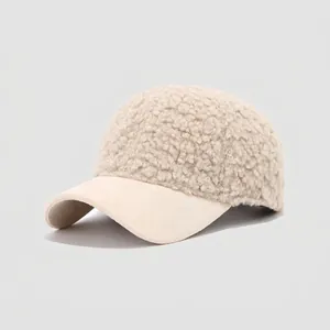 Detail of beige sherpa wool kids baseball cap with soft suede brim for winter comfort