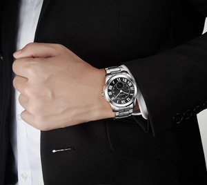 Detailed view of DEDIMA men's watch with Roman numerals and silver steel strap