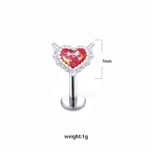 Silver labret piercing jewelry featuring a red heart opal stone and winged design