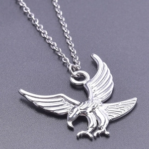 Close-up detail of silver eagle pendant showing intricate wing feather textures
