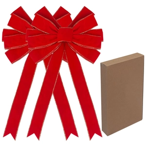Red velvet Christmas bows with gold edges and kraft paper gift box on white background