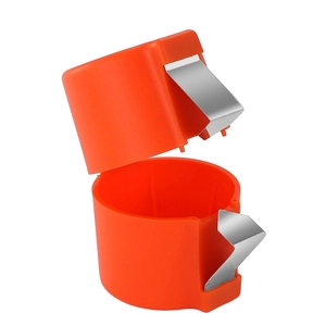 Orange plastic and metal egg shell opener kitchen tool for baking on white background