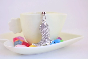 Close-up of sparkling rhinestone-encrusted crystal boot keychain with silver metal finish
