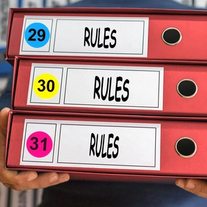 Numbered 1-100 round color stickers on red binder for office organization sorting