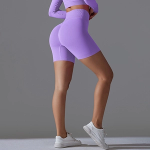 Close-up of purple high-waisted seamless yoga shorts showing breathable mesh and lifting detail