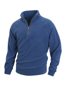 Detail of blue men's fleece sweatshirt with half-zip stand collar and raglan sleeves