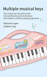 Detail of pink 13-key kids electronic piano with musical keys and cute studio decals