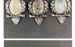 Three owl pendants with natural mother of pearl and abalone shell in retro silver plating