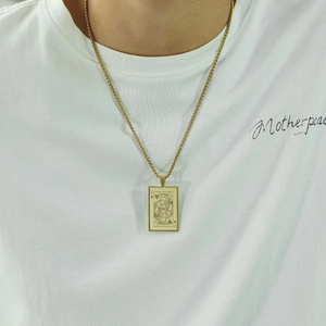 Classic stainless steel necklace with gold-toned King of Hearts poker card pendant on model