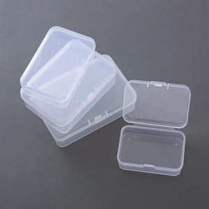 Three transparent rectangular plastic organizers with flip lids for jewelry and small items