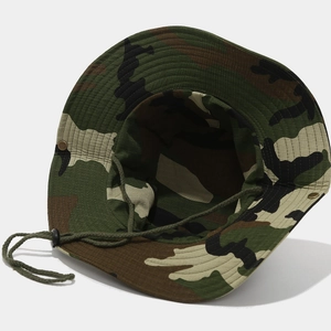 Detail of camouflage boonie hat featuring metal ventilation eyelets and adjustable chin strap