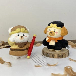 Close-up of hand-carved wooden Monkey King and Monk figurines on a natural wood base