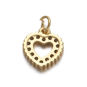 Macro shot of 18K gold plated heart pendant with sparkling cubic zirconia inlay