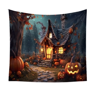Detail of Halloween tapestry showing glowing pumpkins and a fantasy cottage at night