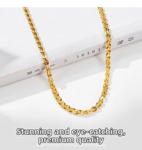 Macro detail of high-quality stainless steel woven chain with gold texture and metallic shine