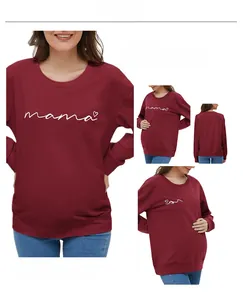 Detail view of burgundy maternity sweatshirt with mama print and soft cotton fabric