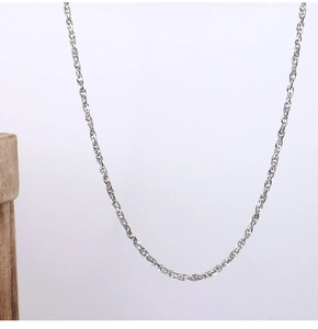 Detail view of silver stainless steel link chain with clear metal texture and high polish