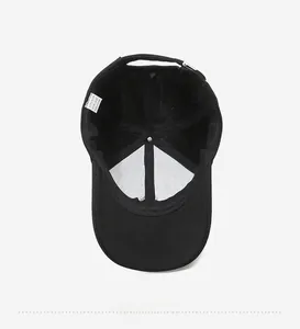 Internal view of black polyester baseball cap with reinforced crown and washing label