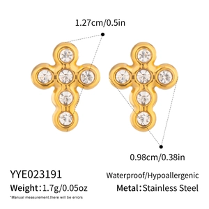 Macro shot of 18K gold-plated cross studs with cubic zirconia and exact dimensions