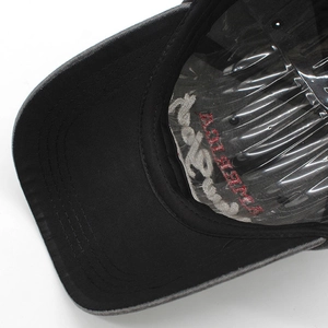 Detail view of cotton baseball cap interior featuring America embroidery and sweatband