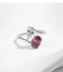 Close-up of S925 silver ring featuring pear and oval cut sparkling cubic zirconia stones