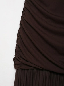 Detail of dark brown dress with ruching and pleated mesh patchwork craftsmanship