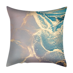 Close-up of pink, purple, and blue marble pattern cushion cover with gold foil texture