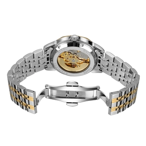 Close-up of skeleton case back showing golden mechanical movement and steel strap