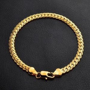 Classic 5mm 18K gold plated curb link chain necklace with lobster clasp on black background