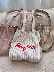Striped canvas tote bags with Bonjour embroidery and drawstring closure in three colors