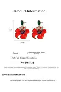 Macro detail of orange flower earrings showing 6x4cm size and silver pin material