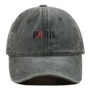 Close-up of Paris embroidery and red Eiffel Tower detail on washed baseball cap