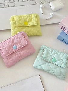 Quilted diamond pattern mini wallets in pastel yellow, pink, and green colors