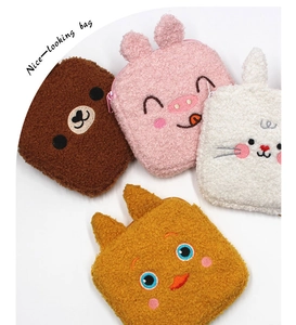 Detail of four colorful plush animal-shaped storage bags with cute embroidery and zippers