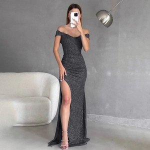 Detail of off-shoulder black glitter evening gown with high side slit for formal events