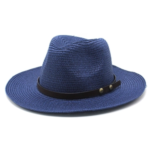 Navy blue straw fedora hat with brown leather band and metallic studs for sun protection
