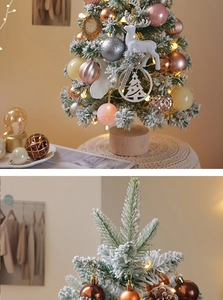 Close-up of pink flocked mini Christmas tree with warm LED lights and ornaments